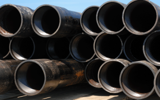 Stack of pipes waiting to be installed at a gas well Stack of pipes waiting to be installed at a gas well