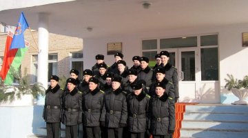 Cadets in winter uniforms on the steps of the school