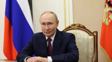 Zdjęcie przedstawia Władimira Putina